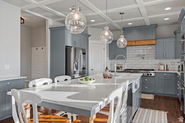 kitchen with dark wood-style flooring, stainless steel refrigerator with ice dispenser, tasteful backsplash, gray cabinets, and coffered ceiling