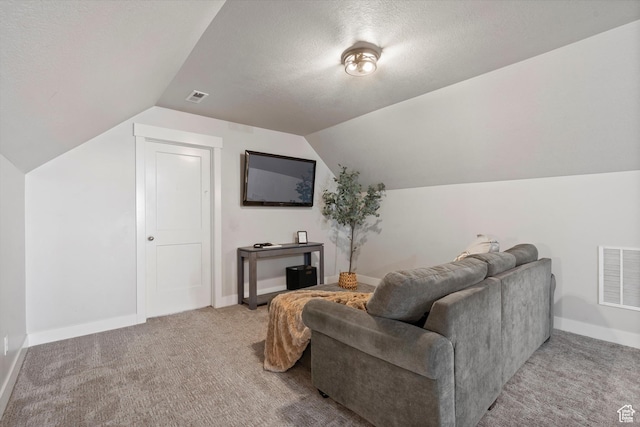 living area featuring light carpet, vaulted ceiling, visible vents, and baseboards