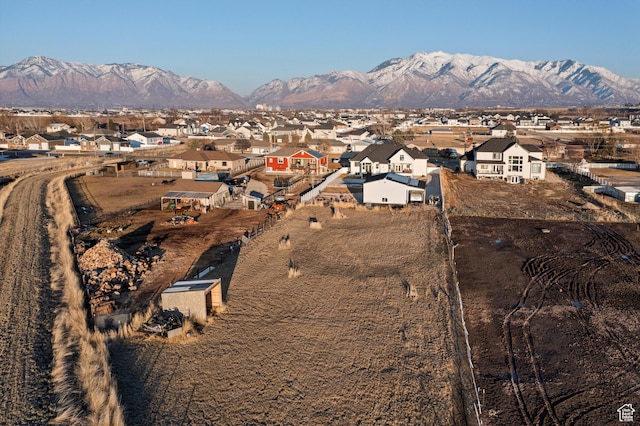 birds eye view of property featuring a mountain view and a residential view