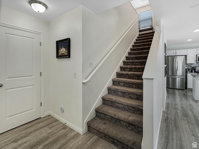 2095 W 3330 S, Syracuse, UT 84075 - stairs featuring wood finished floors and baseboards