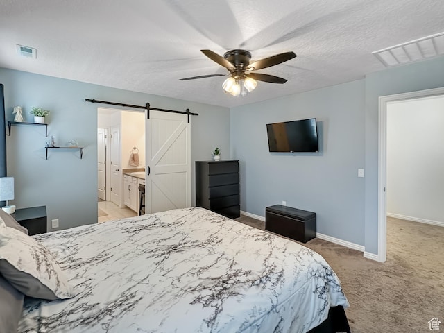 2095 W 3330 S, Syracuse, UT 84075 - carpeted bedroom featuring a barn door, baseboards, ceiling fan, and a textured ceiling