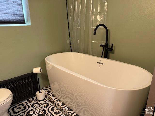 130 S 1300 E Unit 602, Salt Lake City, UT 84102 - bathroom with a freestanding tub and toilet