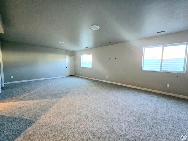 3102 N 2875 W Unit 27, Plain City, UT 84404 - spare room featuring carpet floors and baseboards