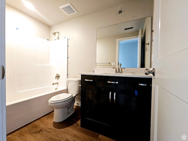 3102 N 2875 W Unit 27, Plain City, UT 84404 - bathroom featuring toilet, wood finished floors, vanity, visible vents, and tub / shower combination