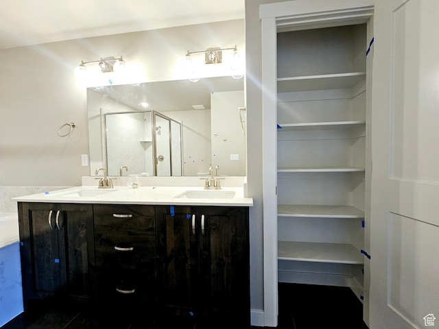 3102 N 2875 W Unit 27, Plain City, UT 84404 - full bathroom featuring double vanity, a stall shower, and a sink