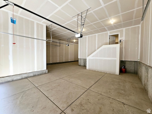 3102 N 2875 W Unit 27, Plain City, UT 84404 - garage featuring a garage door opener