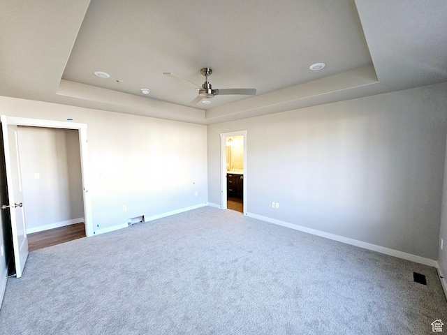 3102 N 2875 W Unit 27, Plain City, UT 84404 - unfurnished bedroom featuring visible vents, baseboards, a raised ceiling, and carpet flooring