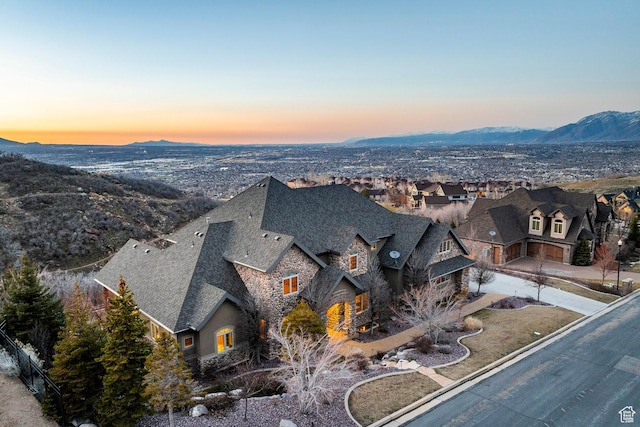 aerial view at dusk with a residential view and a mountain view