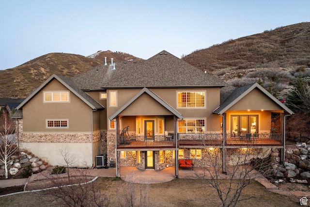 14794 S Vintage View Ln, Draper, UT 84020 - back of property featuring stucco siding, a patio area, a mountain view, cooling unit, and stone siding