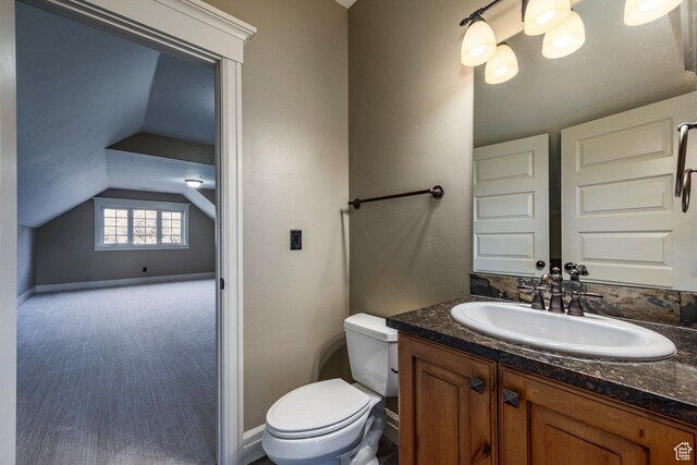 14794 S Vintage View Ln, Draper, UT 84020 - bathroom featuring toilet, baseboards, vaulted ceiling, and vanity
