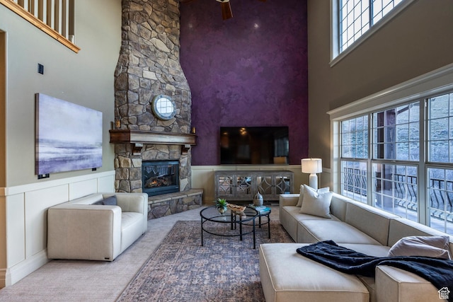 14794 S Vintage View Ln, Draper, UT 84020 - living room featuring a towering ceiling, a fireplace, and wainscoting