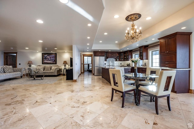 14794 S Vintage View Ln, Draper, UT 84020 - dining space featuring a notable chandelier, a raised ceiling, and recessed lighting
