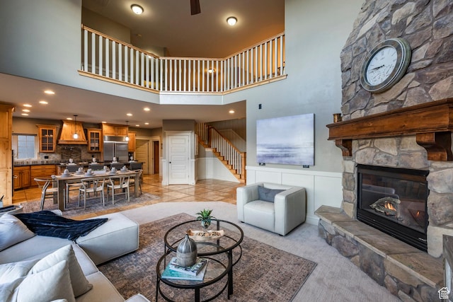 14794 S Vintage View Ln, Draper, UT 84020 - living area with a stone fireplace, stairway, and a high ceiling