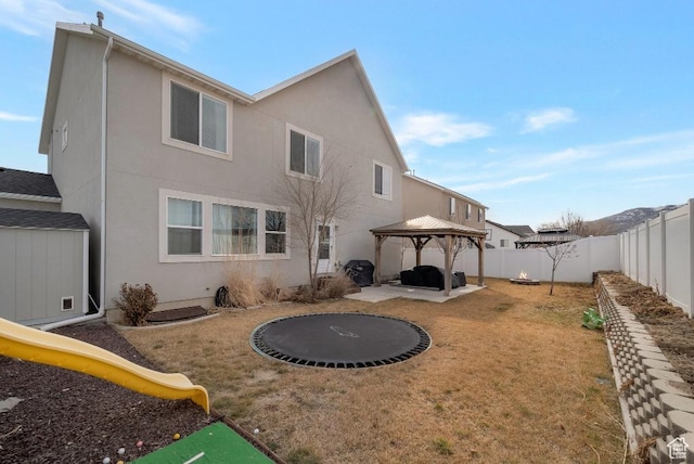 721 S Jubilee Dr, Saratoga Springs, UT 84045 - rear view of house with a playground, a yard, a gazebo, a patio area, and a fenced backyard