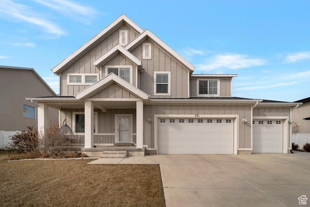 view of front of home featuring driveway, a porch, board and batten siding, and an attached garage