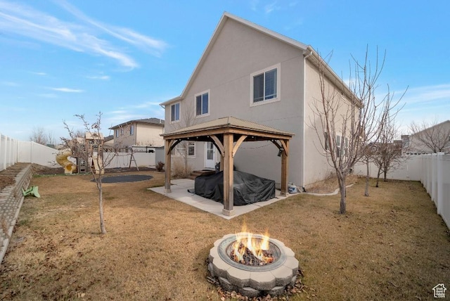 721 S Jubilee Dr, Saratoga Springs, UT 84045 - rear view of property with an outdoor fire pit, a yard, a gazebo, stucco siding, and a patio area