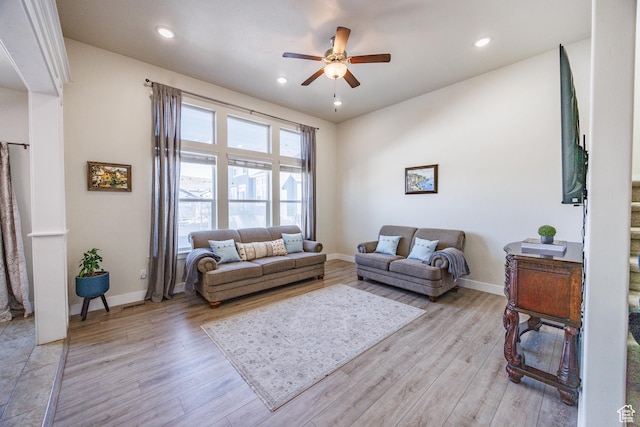 7912 N Secretariat Rd, Eagle Mountain, UT 84005 - living area with baseboards and light wood finished floors
