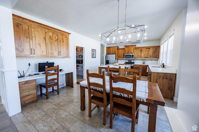7912 N Secretariat Rd, Eagle Mountain, UT 84005 - dining area with light tile patterned floors, visible vents, and built in desk