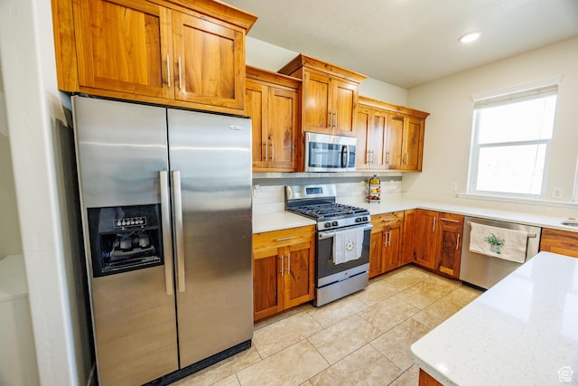 7912 N Secretariat Rd, Eagle Mountain, UT 84005 - kitchen featuring stainless steel appliances and brown cabinets