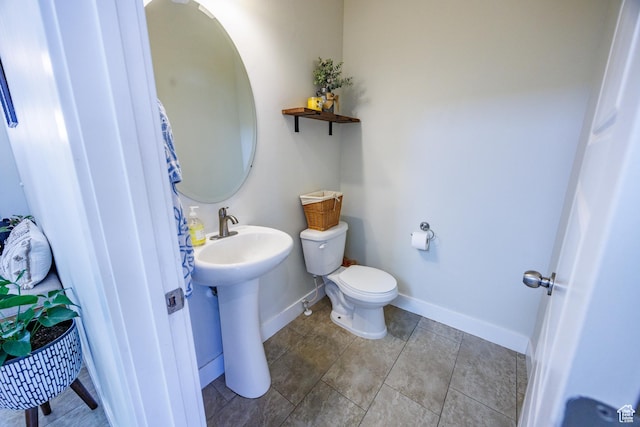 7912 N Secretariat Rd, Eagle Mountain, UT 84005 - half bathroom with a sink, baseboards, toilet, and tile patterned flooring