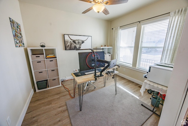 7912 N Secretariat Rd, Eagle Mountain, UT 84005 - home office with baseboards, wood finished floors, and a ceiling fan