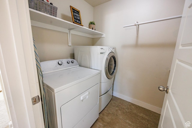 7912 N Secretariat Rd, Eagle Mountain, UT 84005 - clothes washing area featuring light tile patterned floors, baseboards, separate washer and dryer, and laundry area