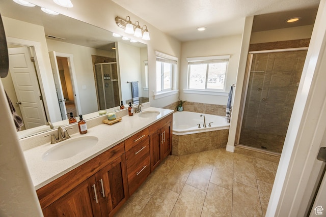 7912 N Secretariat Rd, Eagle Mountain, UT 84005 - full bathroom featuring a bath, visible vents, a shower stall, and a sink