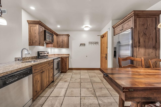 2260 Park Ave Unit 11, Park City, UT 84060 - kitchen featuring baseboards, appliances with stainless steel finishes, light stone countertops, a sink, and recessed lighting