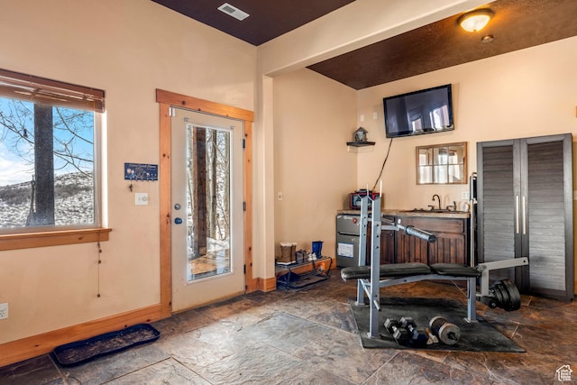 3478 E Porcupine Cir, Garden City, UT 84028 - foyer entrance with stone tile floors, baseboards, and visible vents