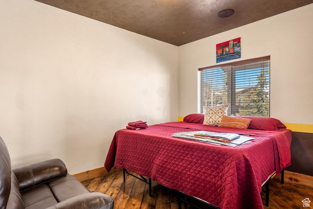 3478 E Porcupine Cir, Garden City, UT 84028 - bedroom featuring baseboards and wood-type flooring