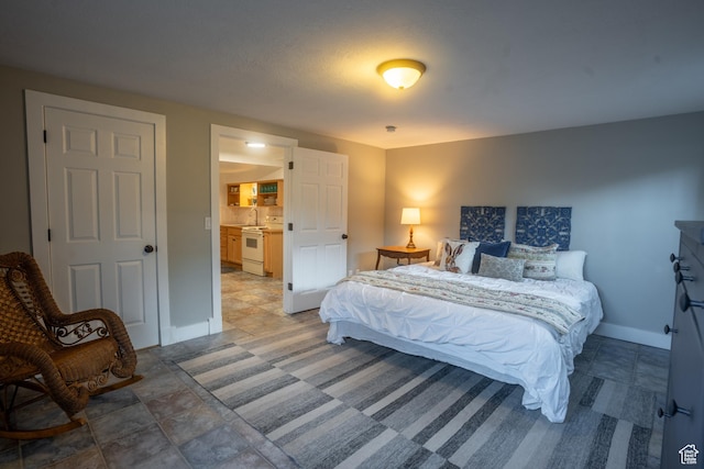 bedroom featuring baseboards