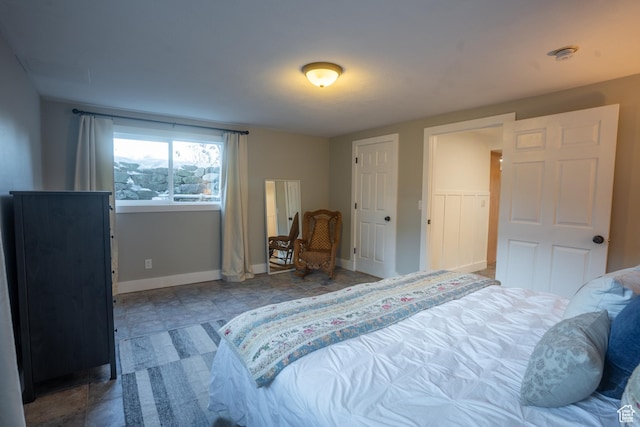 bedroom featuring baseboards