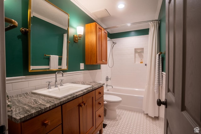 bathroom with vanity, tile walls, shower / tub combo, toilet, and ornamental molding