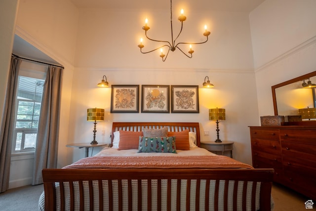 bedroom with an inviting chandelier, carpet floors, and a towering ceiling