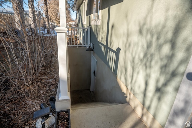 view of side of property featuring stucco siding