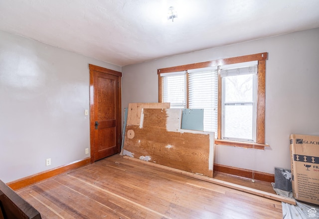 429 W Center St, Logan, UT 84321 - spare room with plenty of natural light, baseboards, and hardwood / wood-style floors