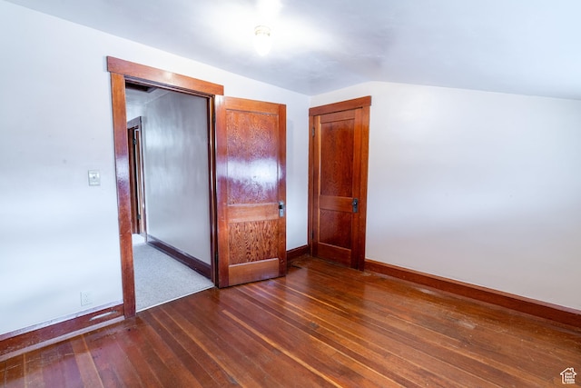 429 W Center St, Logan, UT 84321 - unfurnished room with lofted ceiling, dark wood-style floors, and baseboards