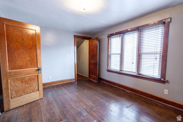 429 W Center St, Logan, UT 84321 - unfurnished bedroom with baseboards and hardwood / wood-style floors