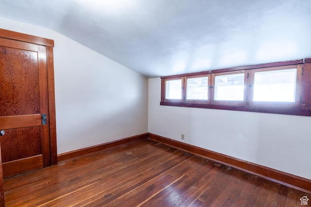 429 W Center St, Logan, UT 84321 - unfurnished room with lofted ceiling, dark wood finished floors, and baseboards