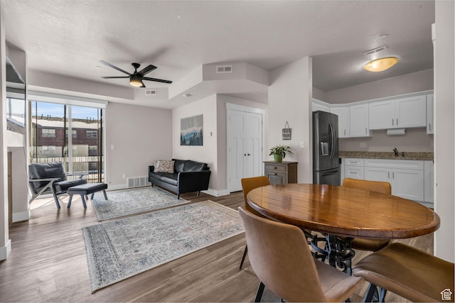 1051 S 500 E Unit E203, Heber City, UT 84032 - dining space featuring wood finished floors and visible vents