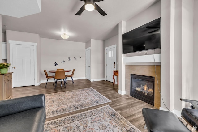 1051 S 500 E Unit E203, Heber City, UT 84032 - living area with a tile fireplace, wood finished floors, a ceiling fan, and baseboards