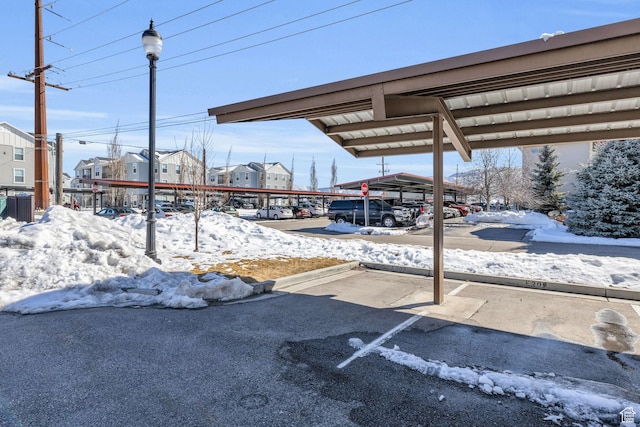 1051 S 500 E Unit E203, Heber City, UT 84032 - snow covered parking area with covered parking