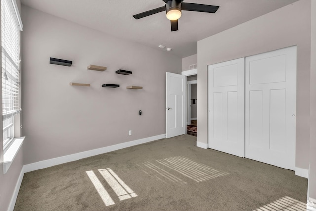 1051 S 500 E Unit E203, Heber City, UT 84032 - unfurnished bedroom with ceiling fan, carpet floors, visible vents, baseboards, and a closet
