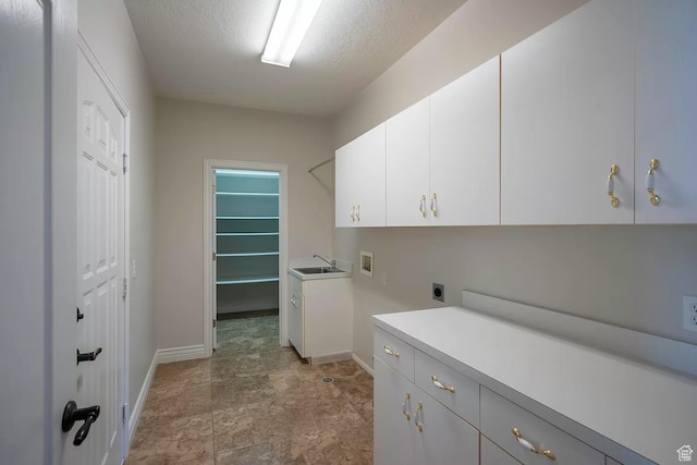1986 Dove Dr, Santa Clara, UT 84765 - laundry room featuring a textured ceiling, hookup for a washing machine, hookup for an electric dryer, a sink, and cabinet space