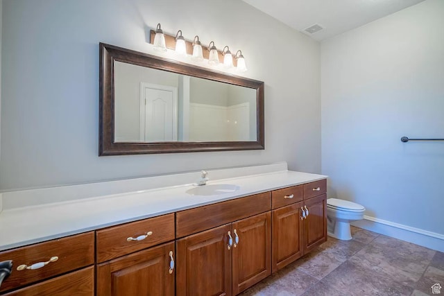 1986 Dove Dr, Santa Clara, UT 84765 - bathroom with toilet, vanity, visible vents, and baseboards