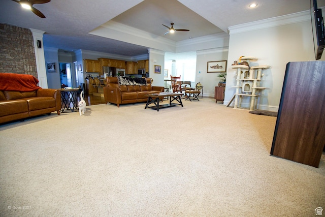 1986 Dove Dr, Santa Clara, UT 84765 - carpeted living room with crown molding, a raised ceiling, ceiling fan, and baseboards