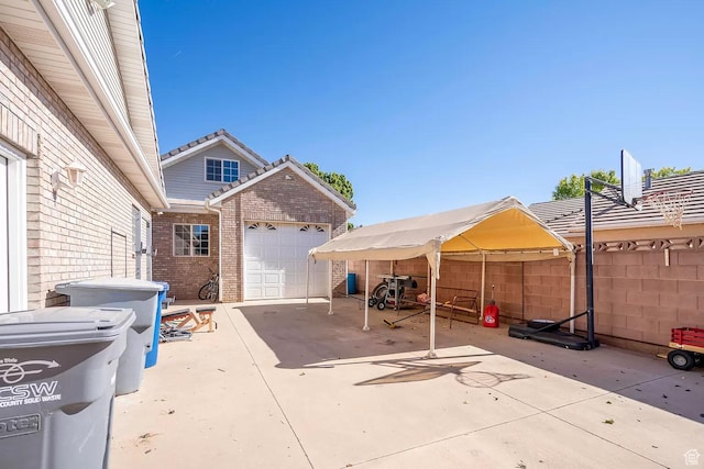 1986 Dove Dr, Santa Clara, UT 84765 - view of patio / terrace with concrete driveway, fence, and an attached garage