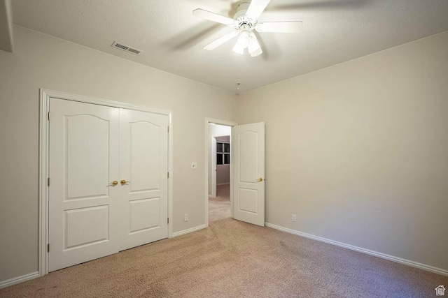 1986 Dove Dr, Santa Clara, UT 84765 - unfurnished bedroom with baseboards, visible vents, a ceiling fan, and light colored carpet