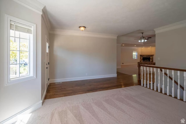 1986 Dove Dr, Santa Clara, UT 84765 - unfurnished room featuring ceiling fan, a stone fireplace, ornamental molding, and baseboards