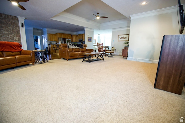1986 Dove Dr, Santa Clara, UT 84765 - living area featuring a ceiling fan, light carpet, crown molding, and baseboards